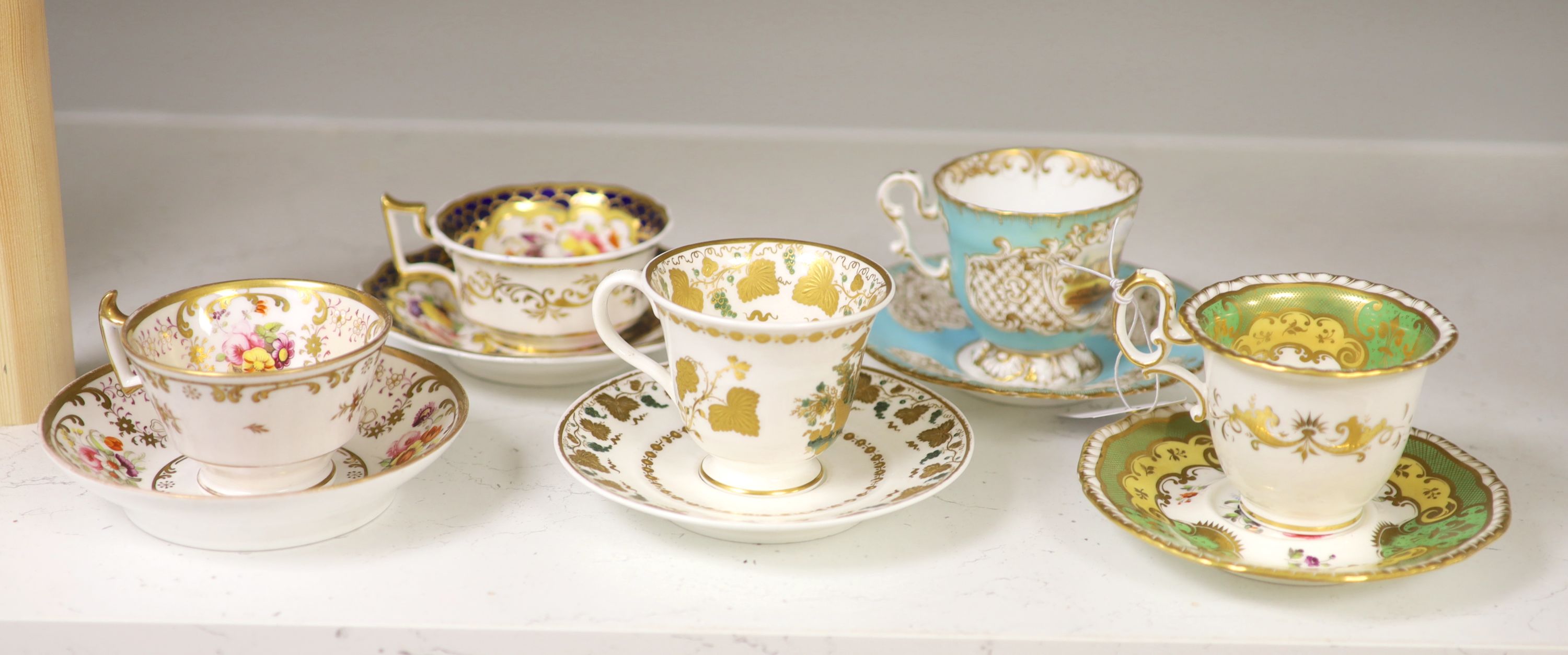 A Spode cup and saucer decorated with raised gilt birds and a basket with green leaves, marked Spode 3916, a Copeland and Garrett turqu